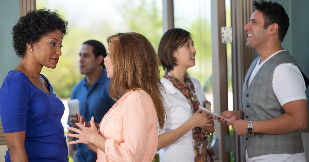 How To Get the Most out of Listening to a Sermon Five people gathered in a church lobby. They talk among themselves, one person holding coffee and another the Bible.